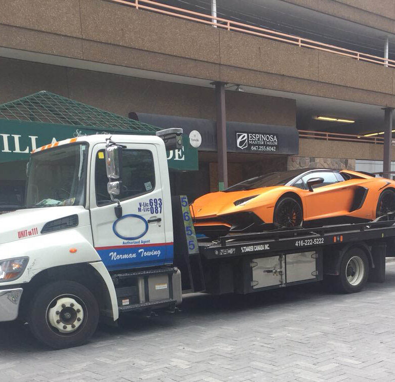 Towing Services & Roadside Assistance In Yorkville, Toronto - Ferrari On a Flatbed Truck