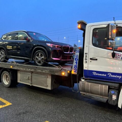 BMW on a Flatbed Tow truck in Toronto -Norman Towing